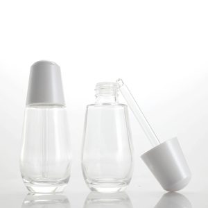 Custom 30ml Round Transparent Press Glass Dropper Bottle Skin Care Serum Press Dropper Bottle